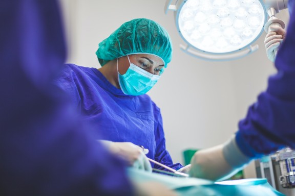 Surgeon working on patient